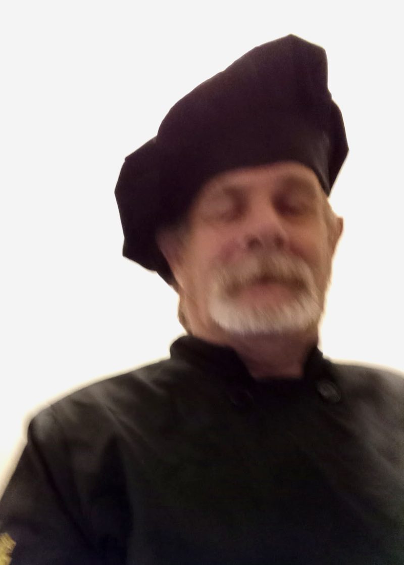 Randy Beckwith in his black chef jacket and chef hat